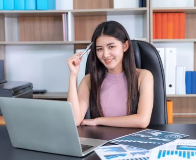 lifestyle beautiful Asian business young woman using laptop computer on office desk , business concept.